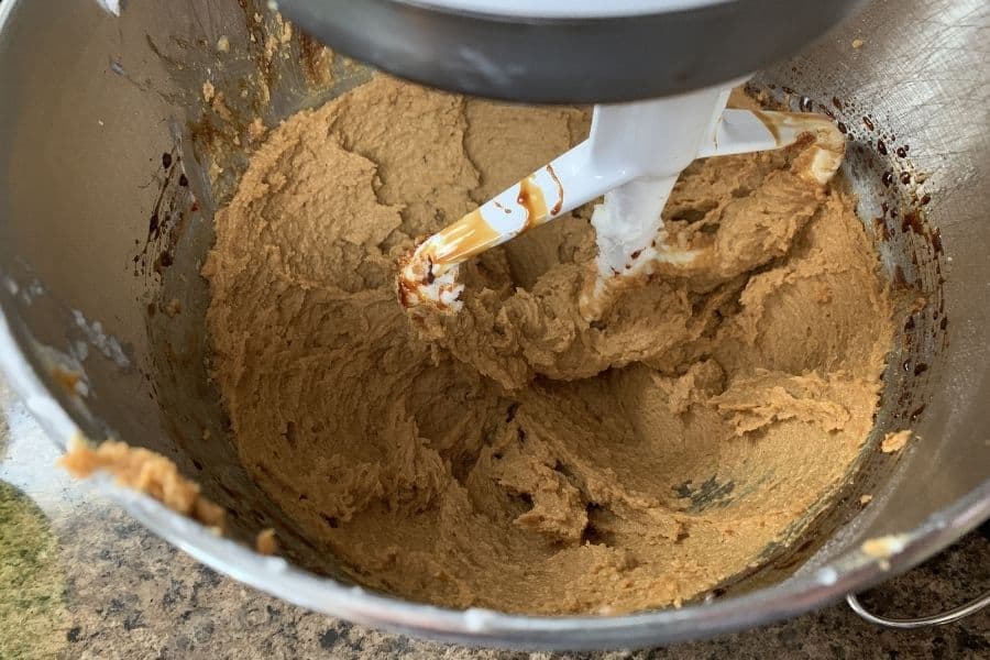shortening, sugar, molasses, and egg mixed together in the bowl of a stand mixer