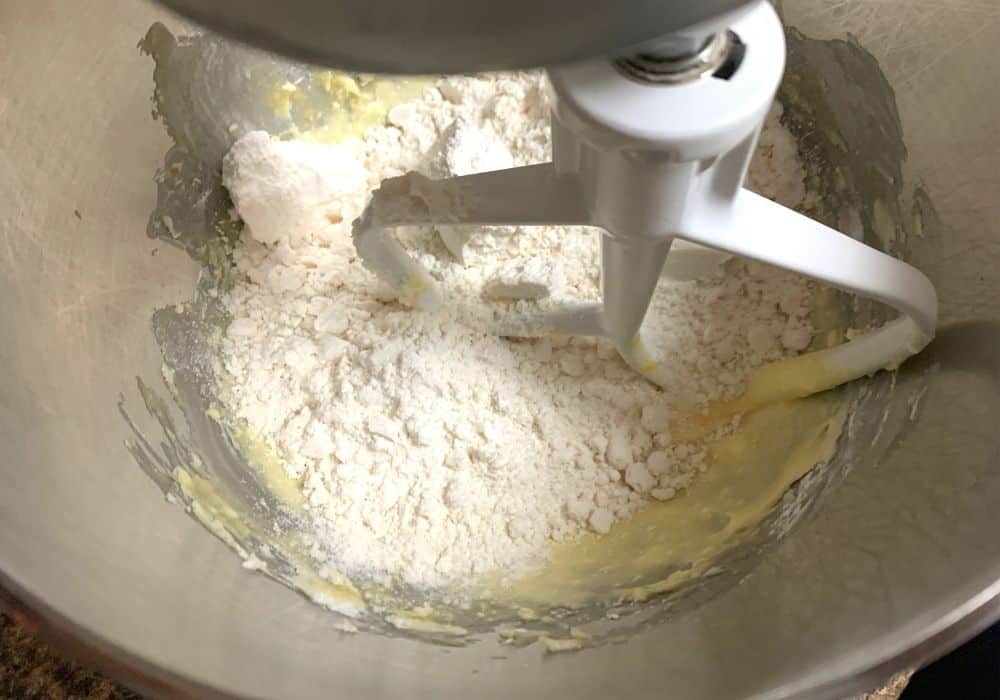 Bisquick baking mix added to the mixing bowl for making sugar cookies.