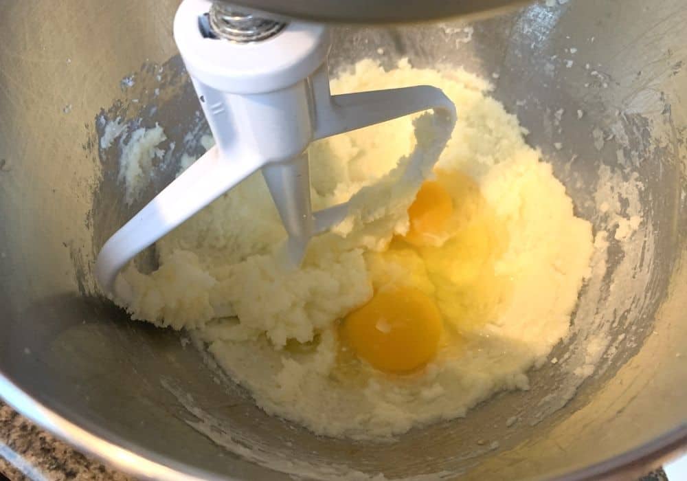 butter, sugar, and eggs being creamed together to make homemade pistachio bread