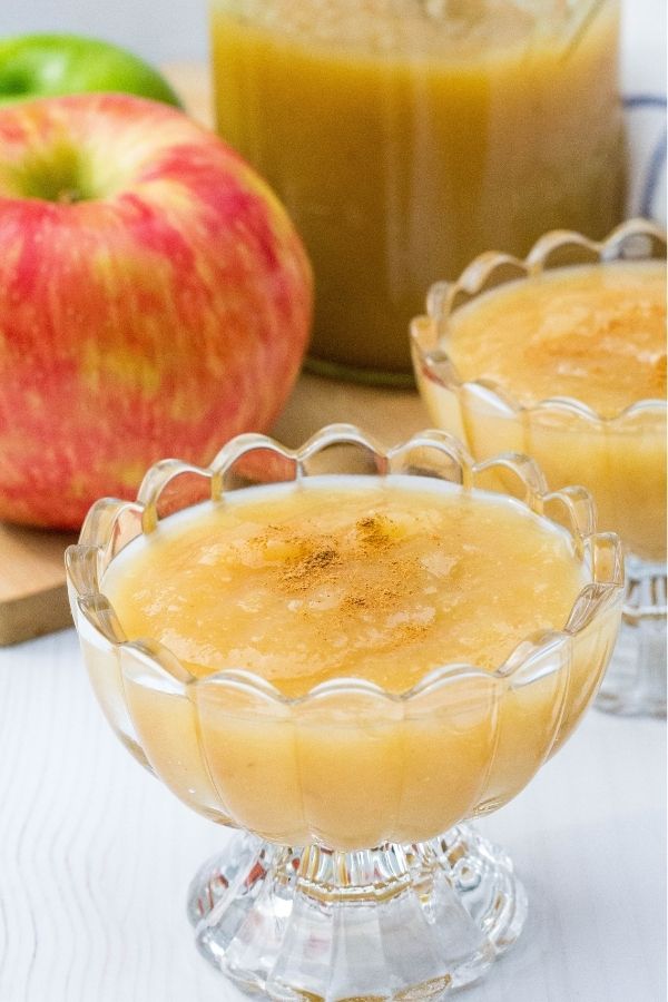 a close-up view of a glass bowl of homemade Instant Pot applesauce