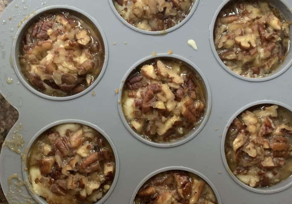 freshly cooked pecan pie cheesecake bites cooling in the mold