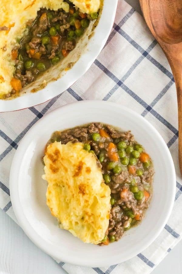 A white plate with a serving of Instant Pot cottage pie on it