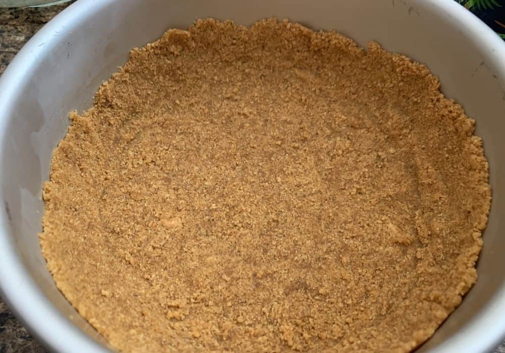 a graham cracker crust pressed into a pan
