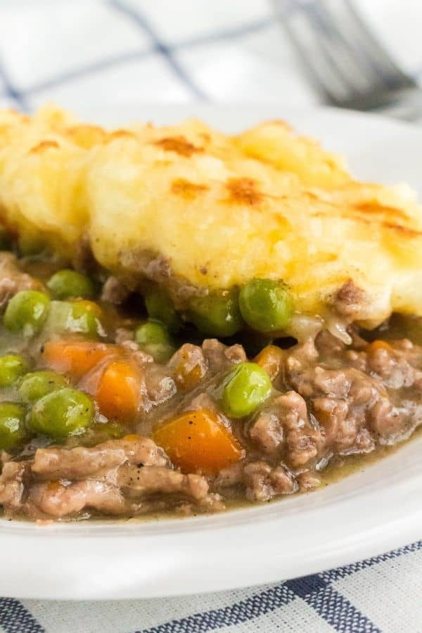 close-up view of shepherd's pie cooked in the Instant Pot, made with ground beef, vegetables, and mashed potato topping.