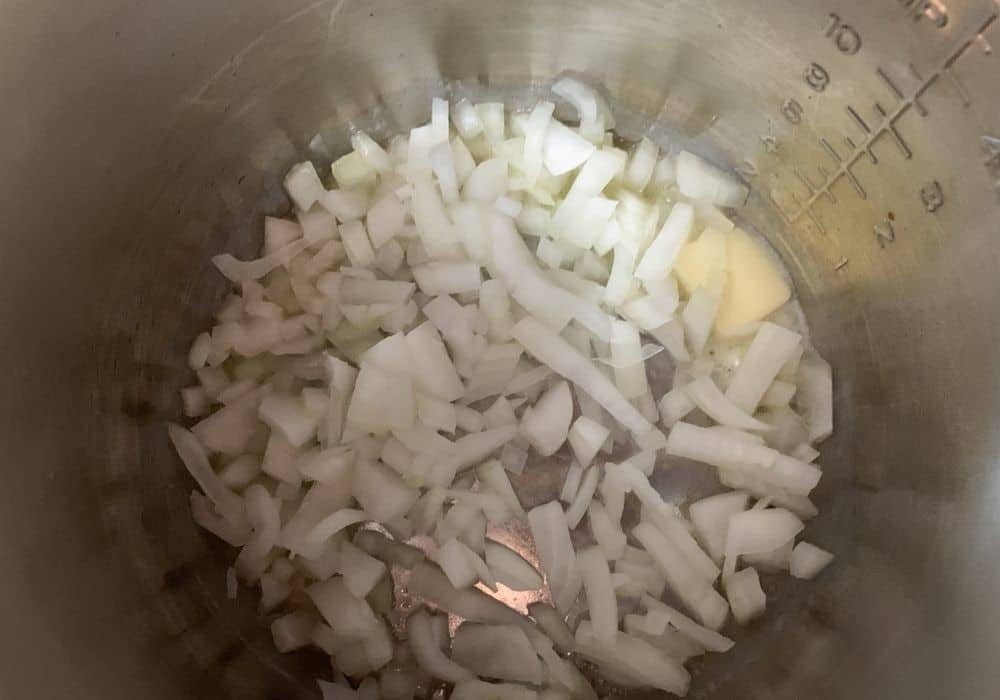 onions and butter in the insert pot of the Instant Pot for chicken chowder