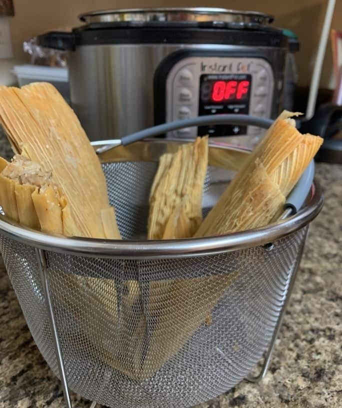 steamer basket of tamales in front of the Instant Pot