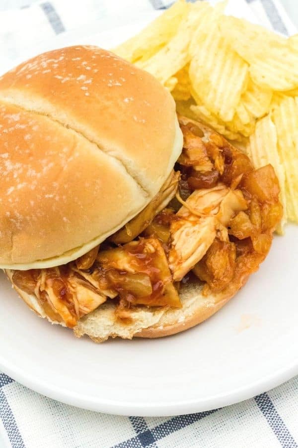 Sandwich bun filled with Instant Pot BBQ chicken cooked with pineapple