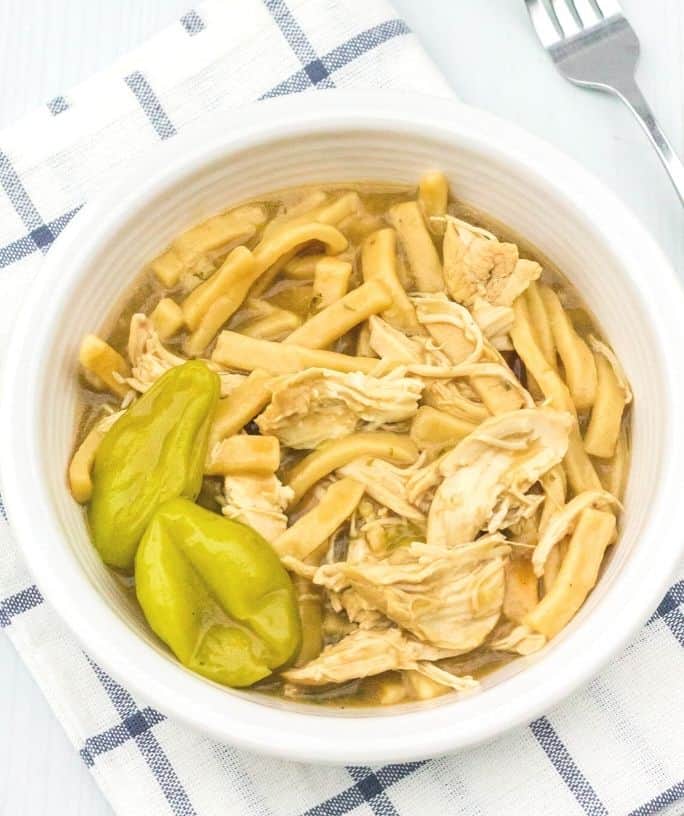 white bowl filled with Instant Pot chicken and noodles