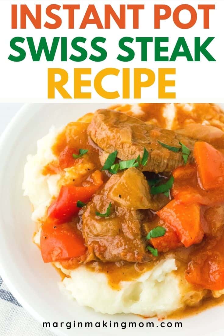 A white plate with a serving of mashed potatoes and Swiss steak cooked in the Instant Pot pressure cooker