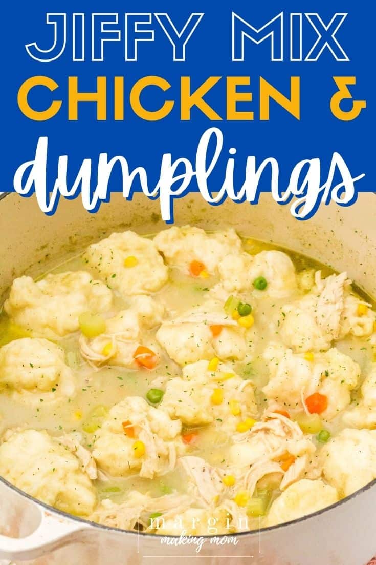 A cream-colored Dutch oven containing a full batch of chicken and dumplings made with Jiffy baking mix