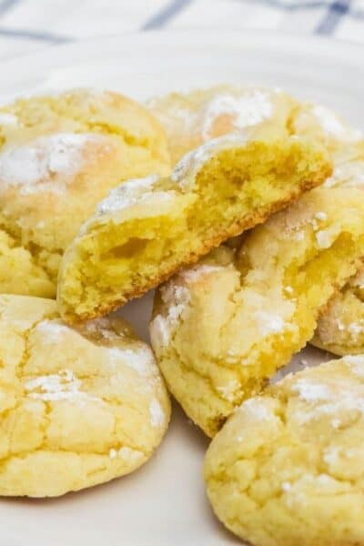 several lemon pudding crinkle cookies on a white plate