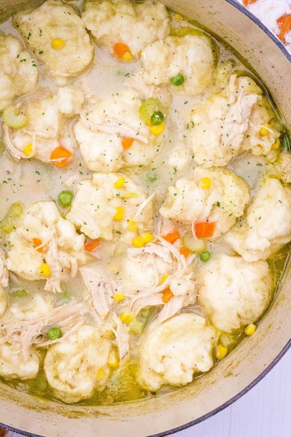 overhead view of a big pot of chicken and dumplings made with Jiffy baking mix