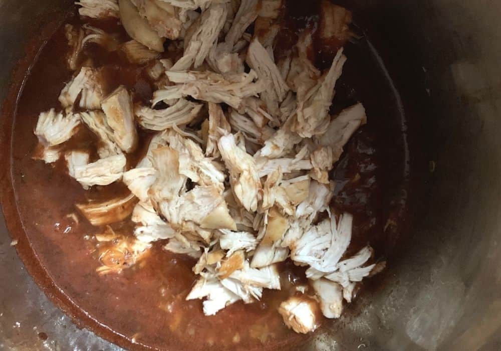 Shredded chicken added back to the pineapple bbq sauce in the Instant Pot