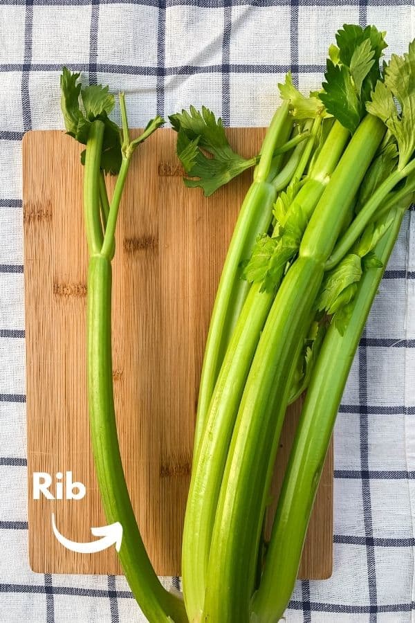 one stalk of celery, with a single rib separated from the bunch, with a label pointing to the individual rib of celery.