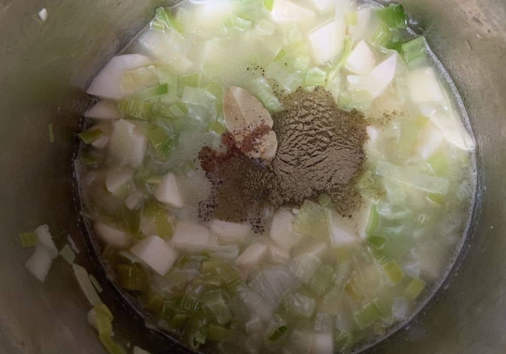 ingredients for potato leek soup in the Instant Pot, ready to be pressure cooked