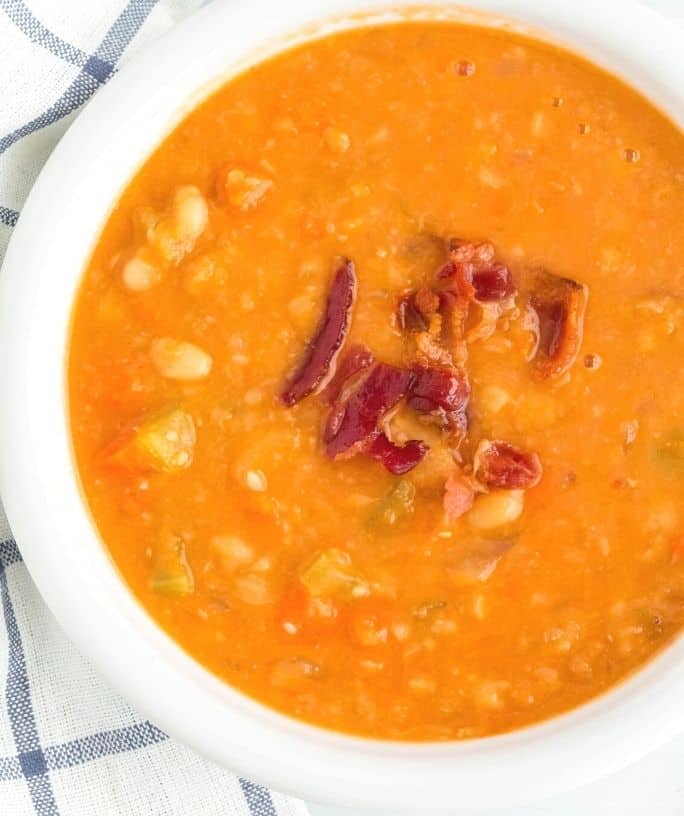 white bowl filled with Instant Pot bean with bacon soup