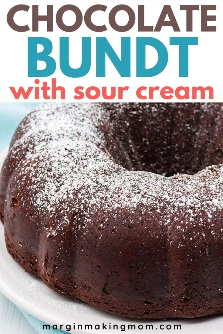 close-up view of a whole chocolate sour cream bundt cake dusted with powdered sugar