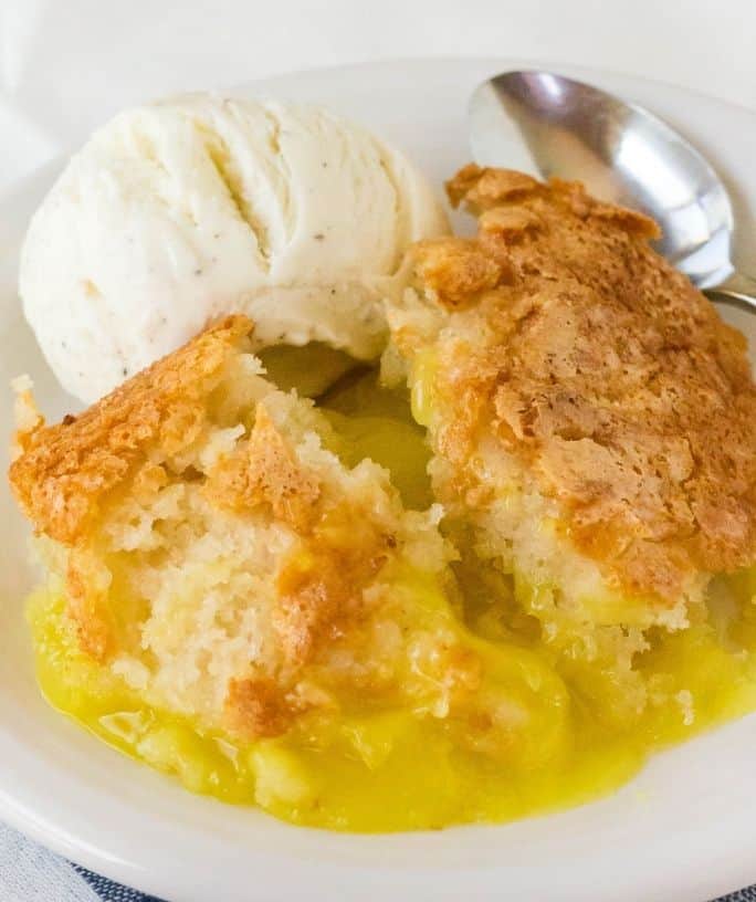 lemon cobbler on a plate with ice cream