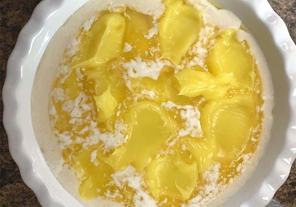 lemon pie filling spooned over the batter and butter 