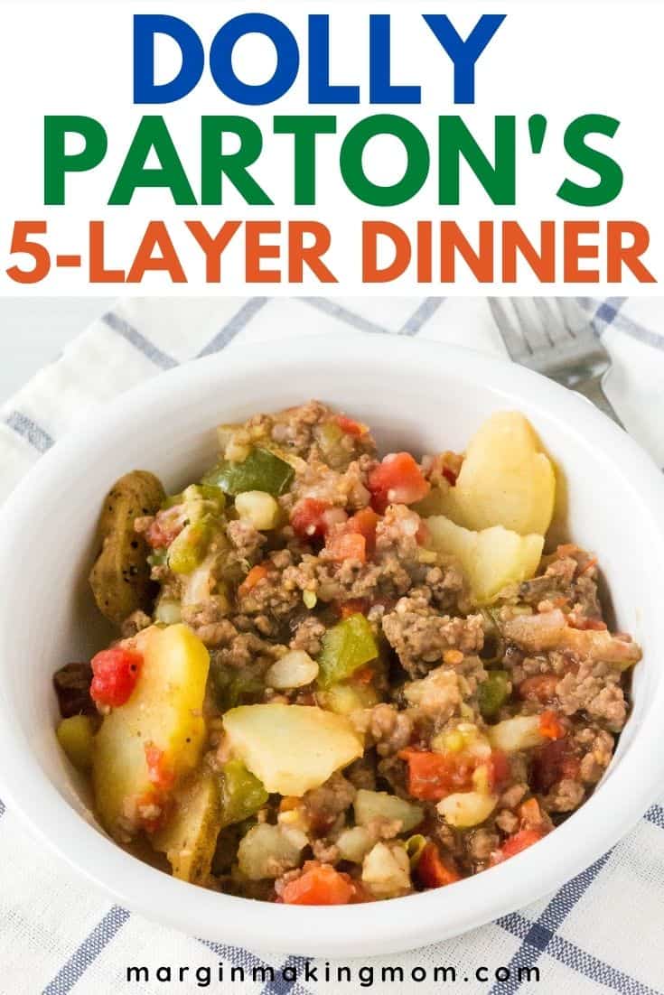 white bowl filled with Dolly Parton's casserole of beef, potatoes, peppers, and tomatoes.