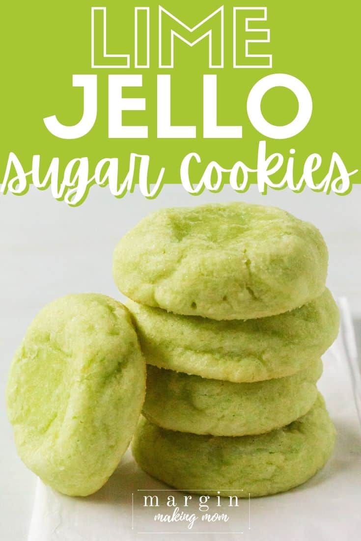 a stack of lime jello sugar cookies on a piece of parchment paper