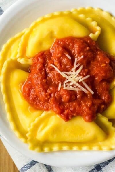 white plate topped with a serving of frozen cheese ravioli cooked in the Instant Pot