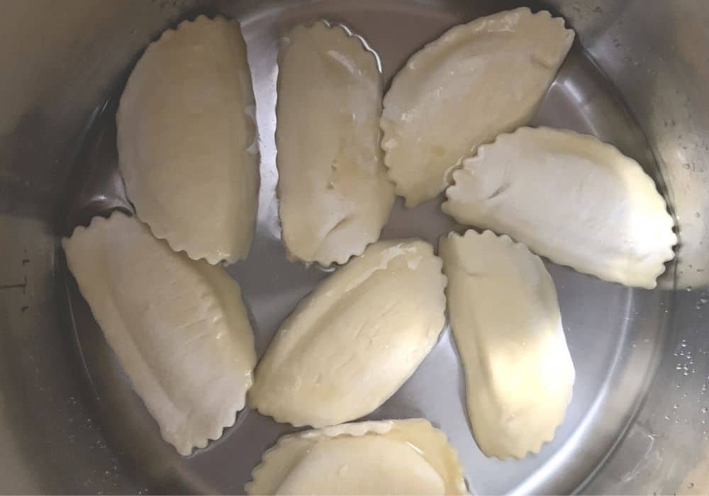 frozen cheese ravioli added to the insert pot of the Instant Pot