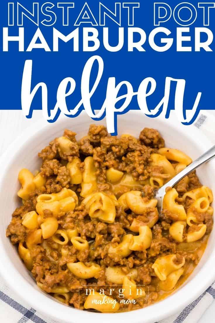 close-up overhead view of a white bowl filled with Hamburger Helper cooked in the Instant Pot, with a fork in the bowl.