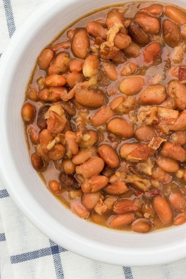 close-up view of a white bowl filled with West Virginia pinto beans cooked in the pressure cooker