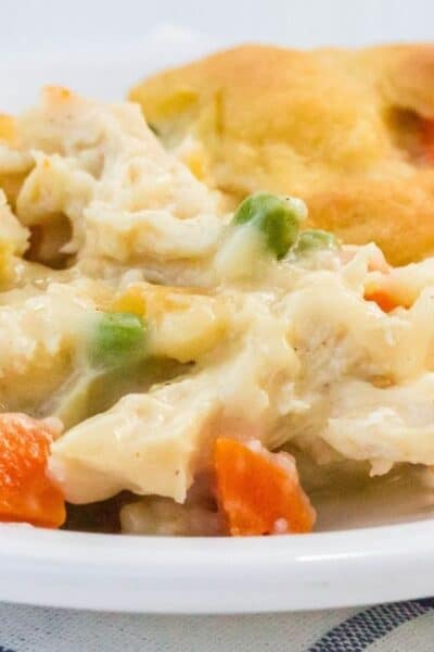 chicken and dumplings casserole serving on a white plate