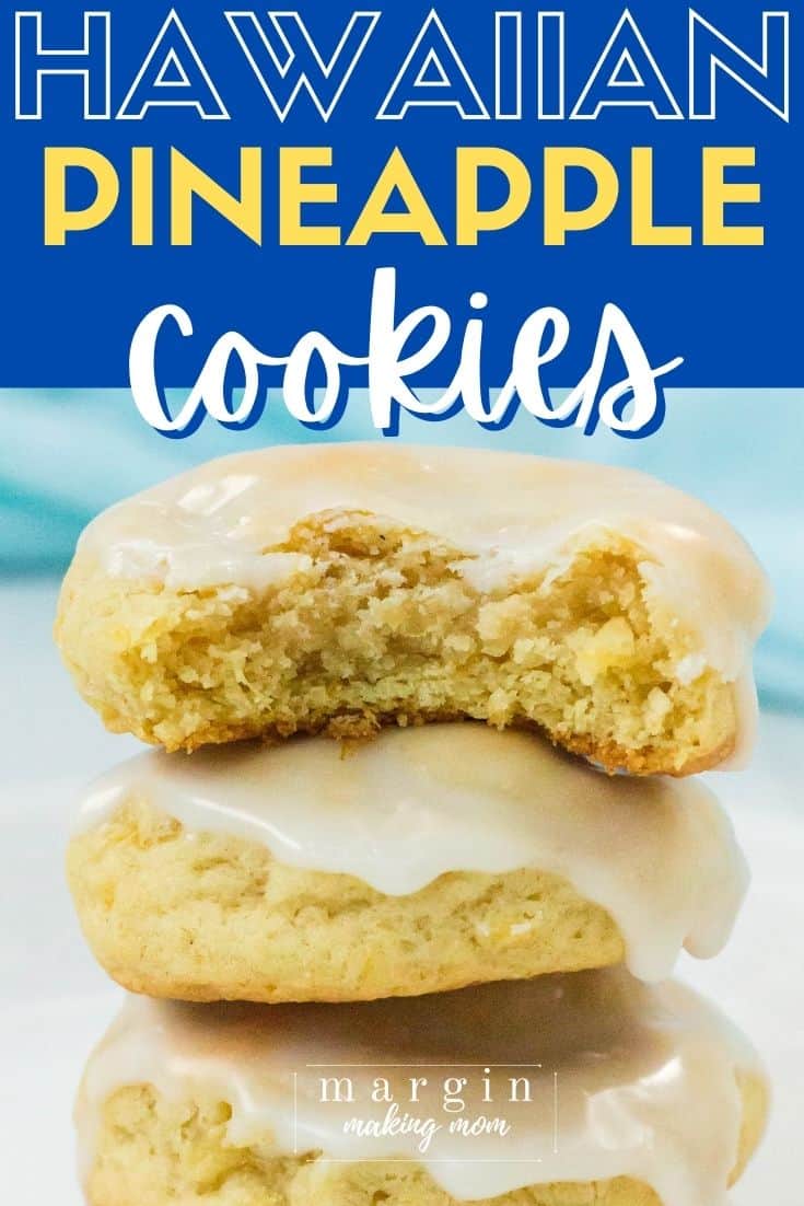 a stack of iced pineapple cookies, with the top cookie having a bite removed, exposing the soft and tender interior