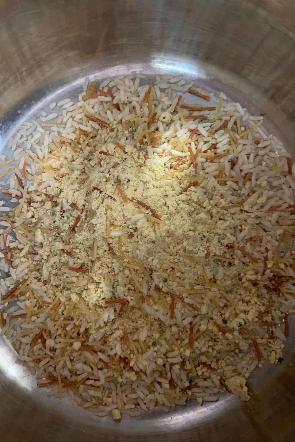 dry contents of a Knorr Rice Sides package dumped into the insert pot of the Instant Pot