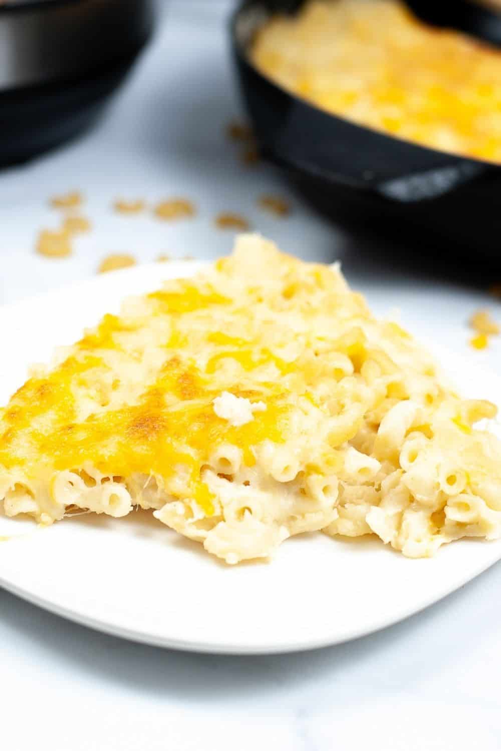 helping of baked mac n cheese on a white plate