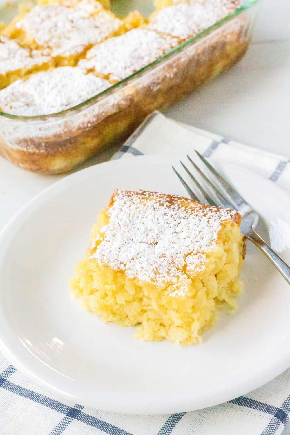 pineapple snack cake slice on a white plate