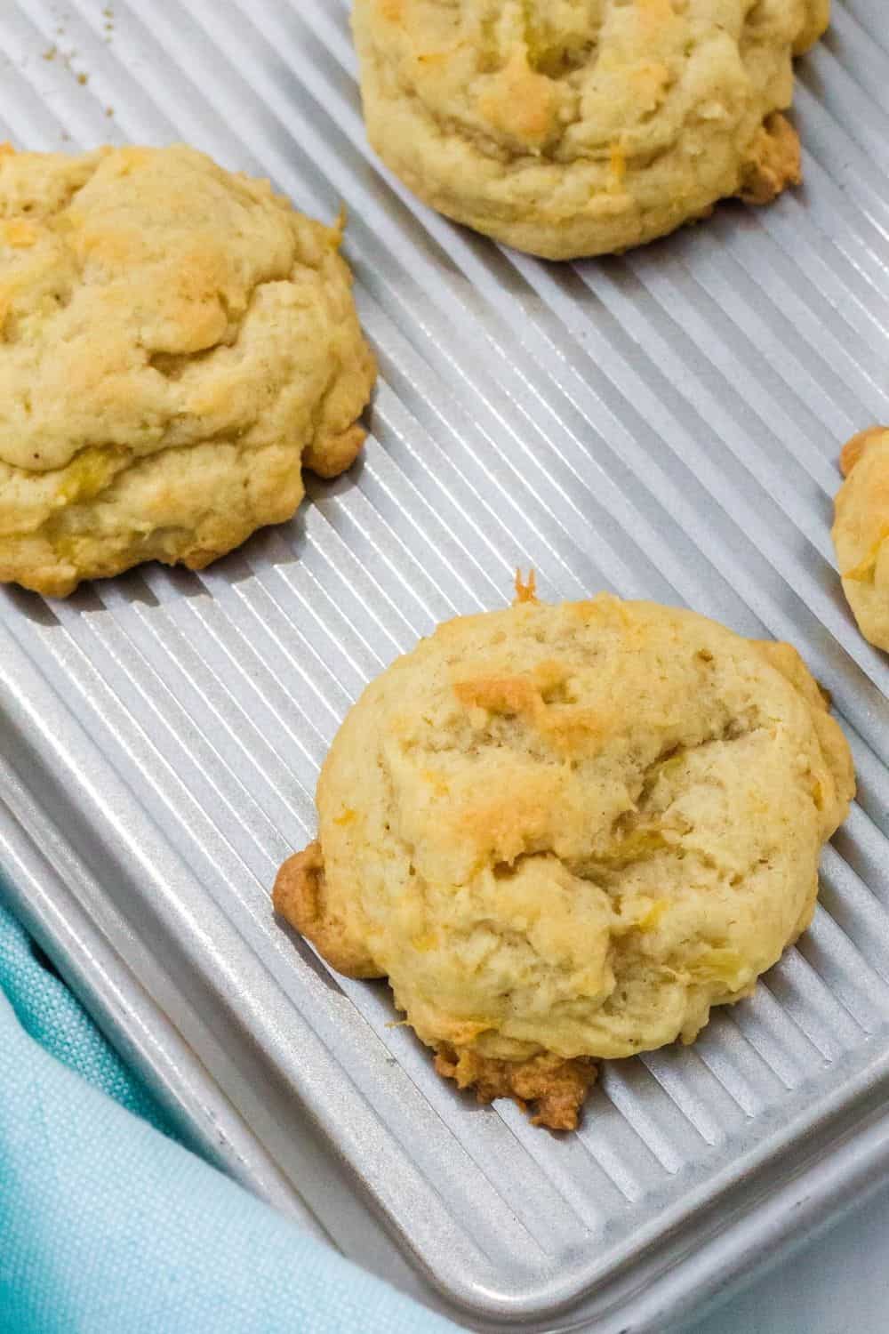 pineapple drop cookies on a baking sheet, fresh out of the oven