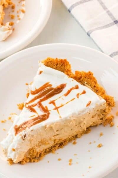 slice of caramel cream pie on white plate
