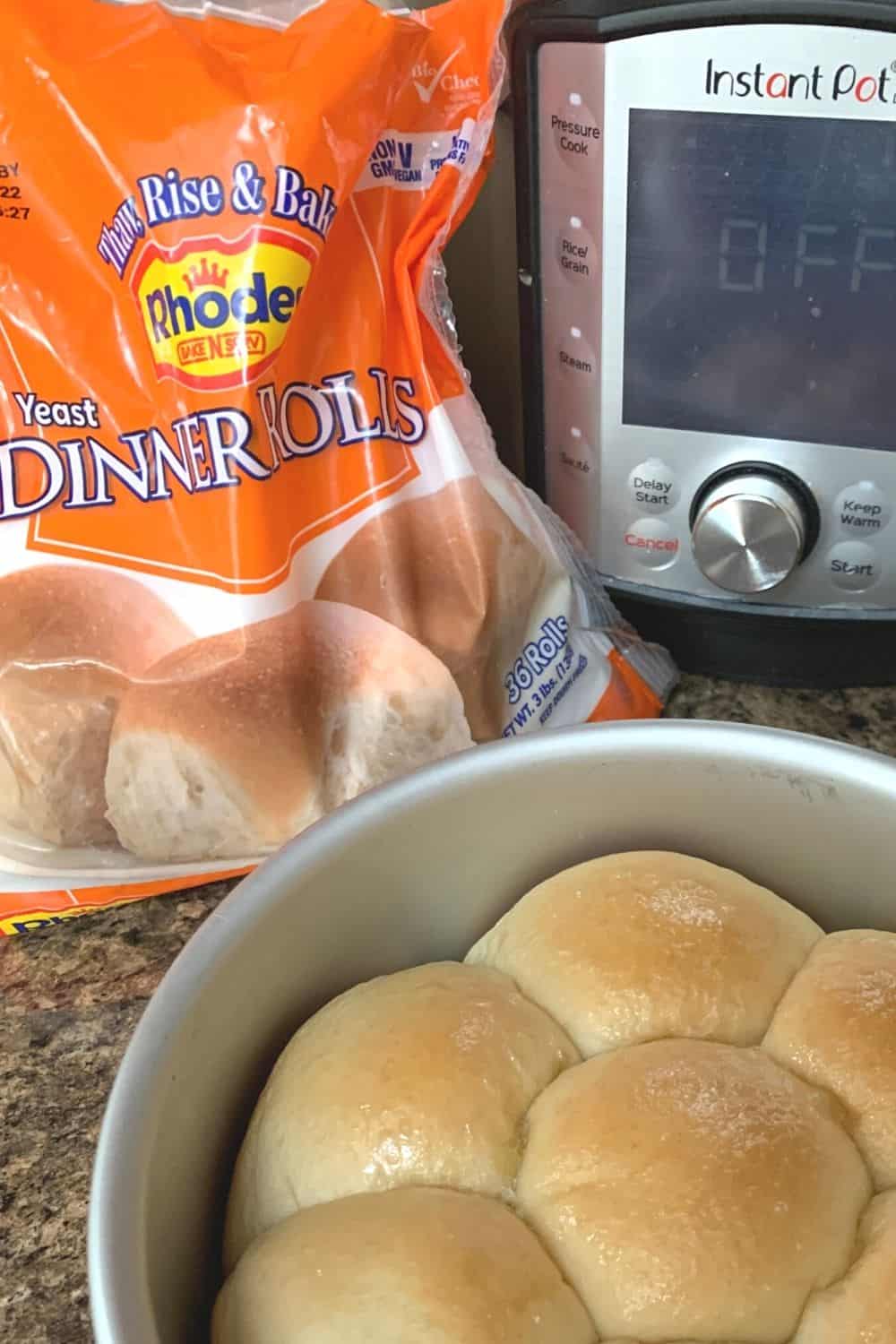 a package of frozen Rhodes yeast rolls next to an Instant Pot, with a pan of baked rolls in the front