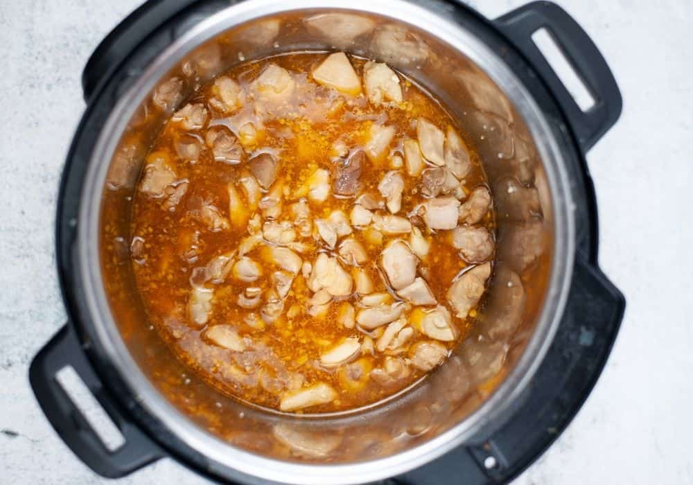 bourbon chicken freshly cooked in the Instant Pot and ready for cornstarch slurry to be added