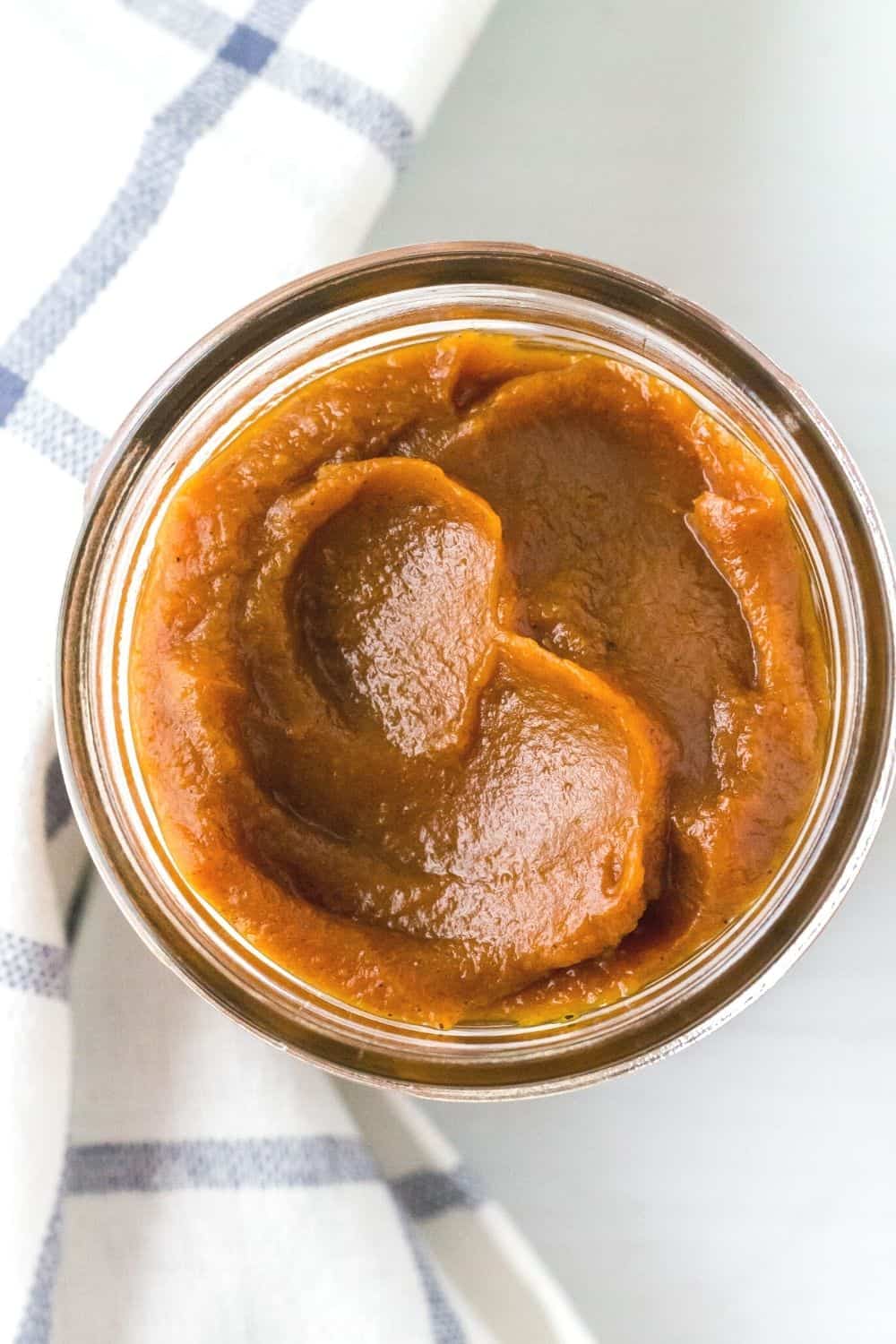 overhead view of a jar of homemade pumpkin butter