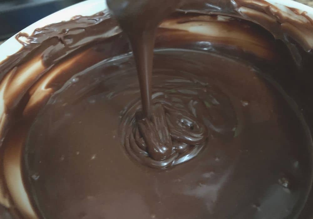 Melted chocolate frosting from a can to serve as ganache topping for bundt cake