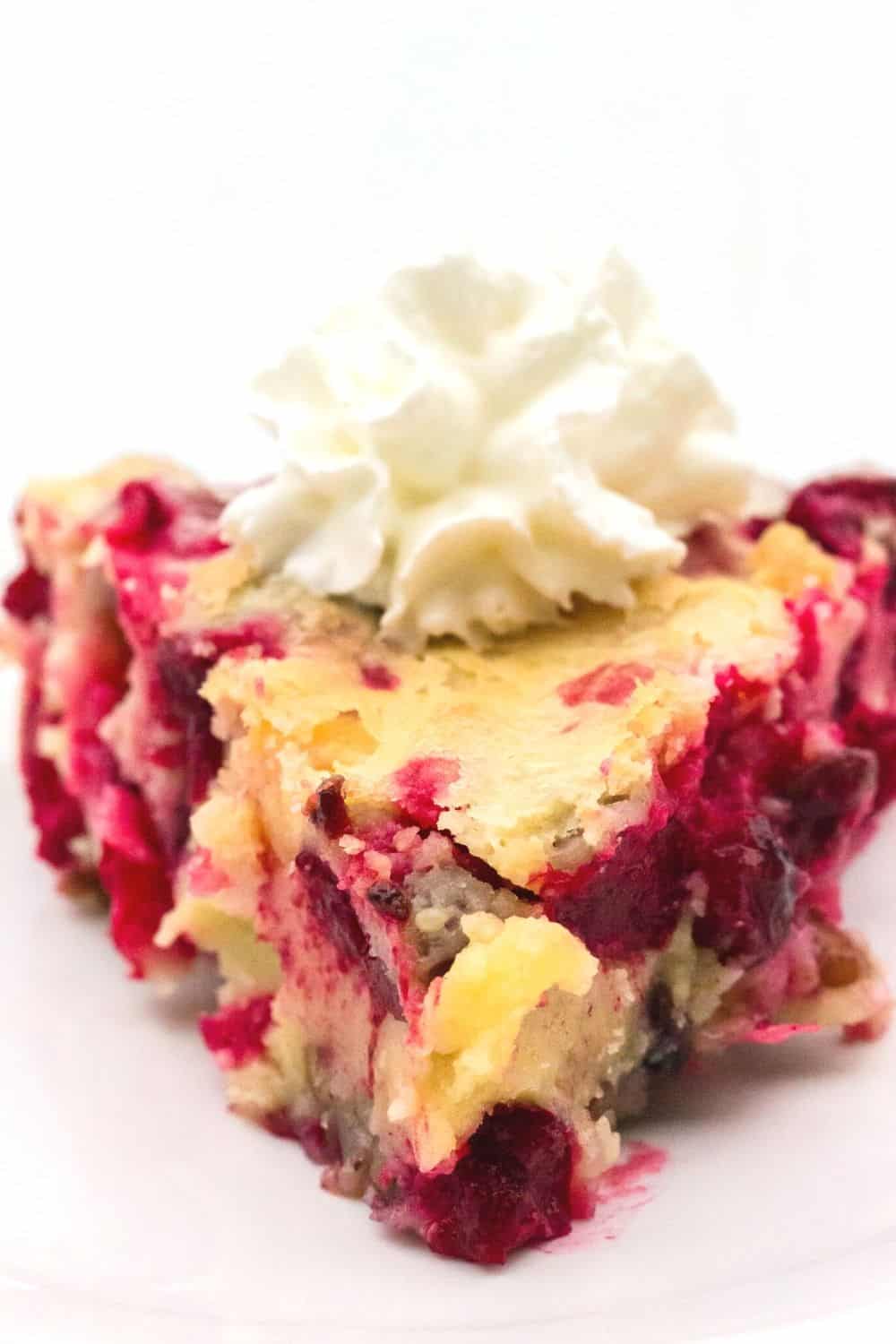 close-up view of a slice of nantucket cranberry pie, showing the cranberries dotting the filling