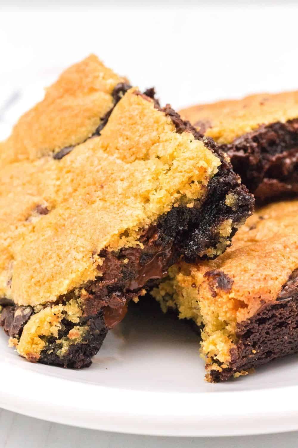 chocolate chip cookie dough brownies served on a whit eplate