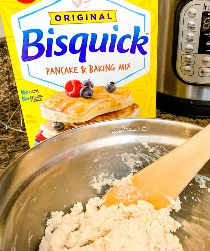 box of Bisquick and a bowl of Bisquick dumpling dough