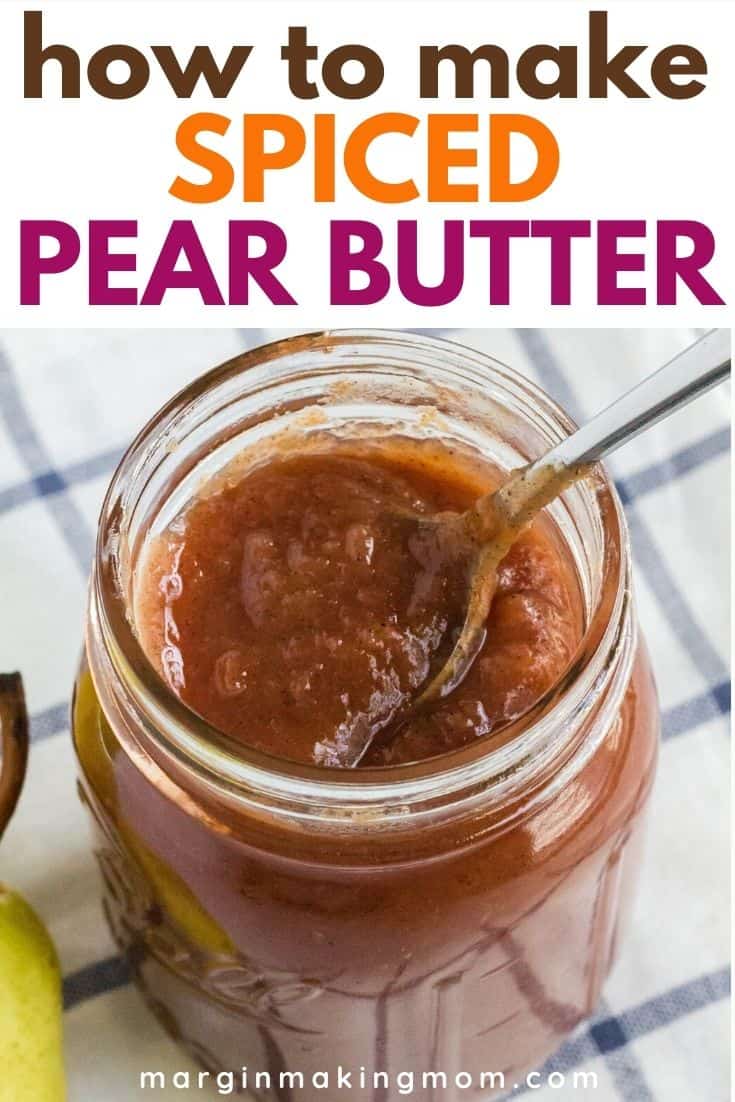 jar of pear butter with a spoon in it