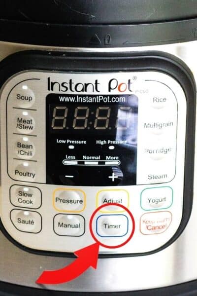close-up of the Instant Pot timer button with a circle around it and an arrow pointing to it