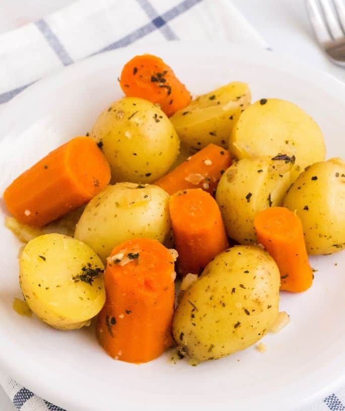 serving of Instant Pot potatoes and carrots on a white plate for serving