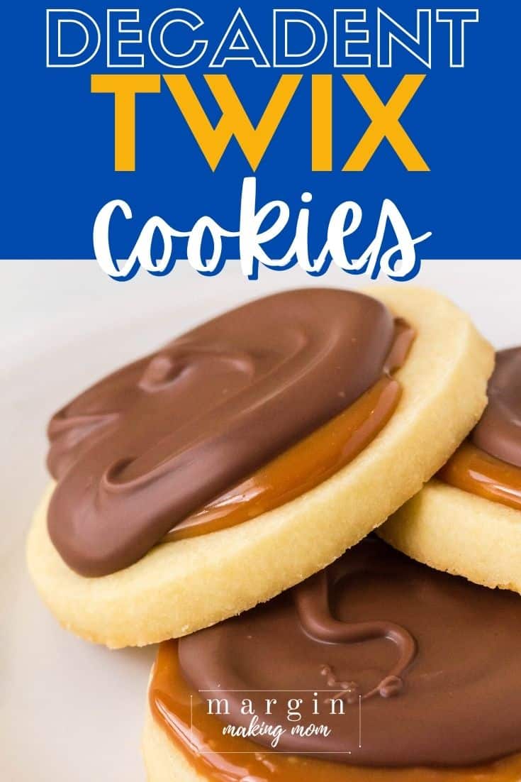 Close-up view of three Twix cookies stacked together, showing the detail of shortbread, caramel, and chocolate on one cookie.