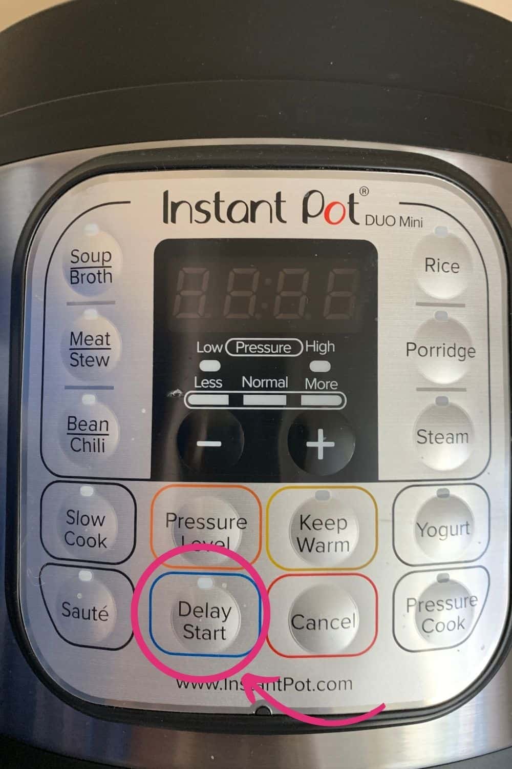 close-up of the control panel of an Instant Pot that does not have a timer button, but instead has a delay start button