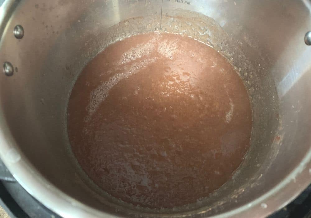 pureed pear butter in the cooking pot
