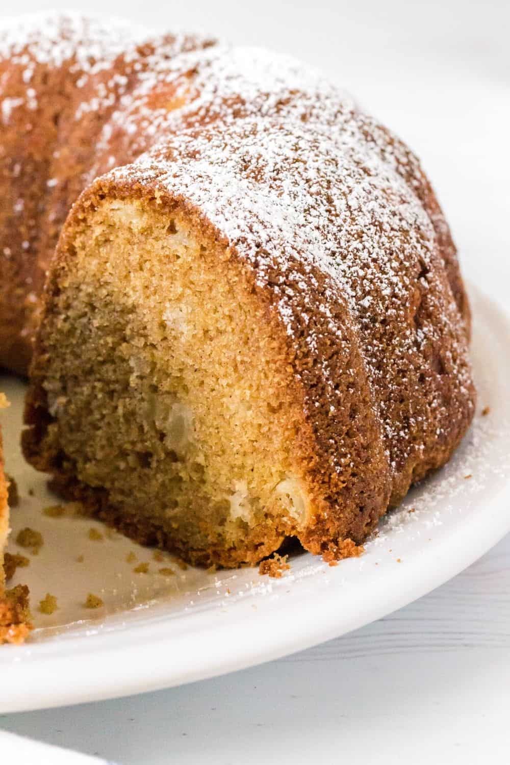 side view of pear cake dusted with powdered sugar